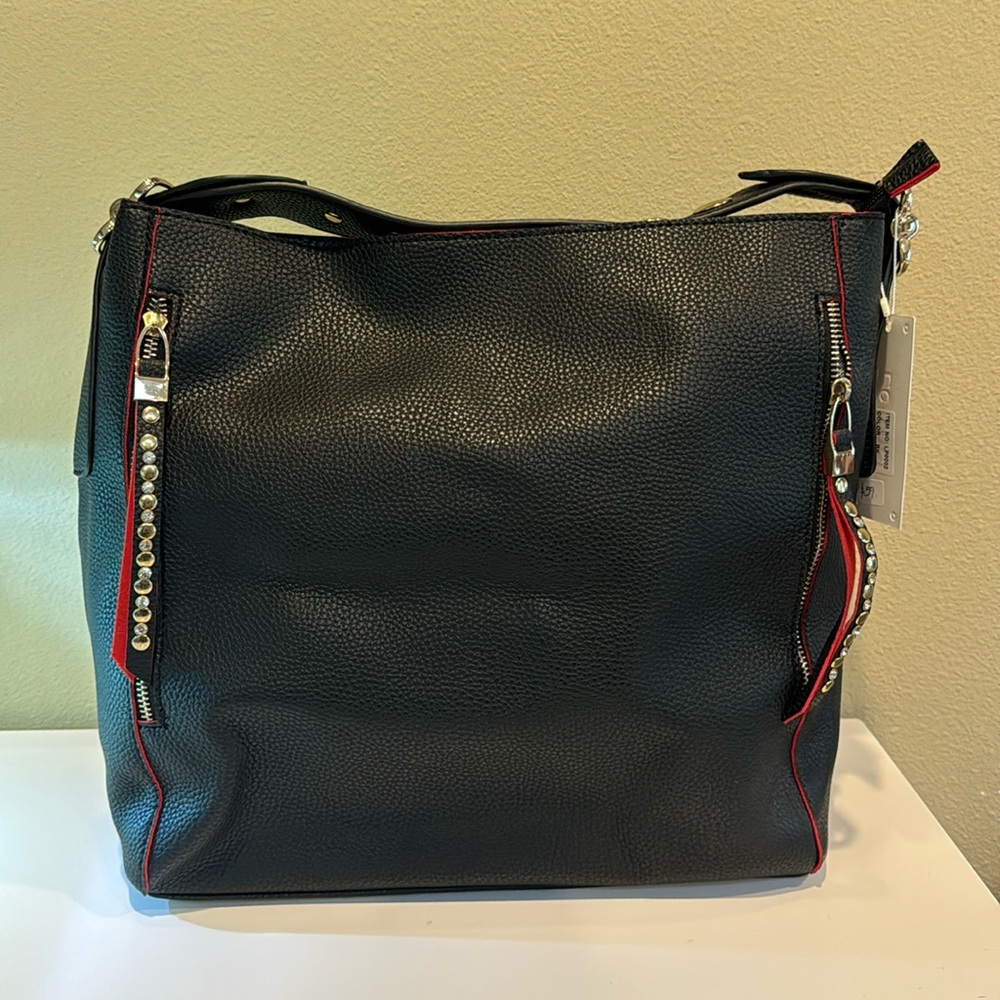 Brand new, never been used black and red Le Miel handbag.